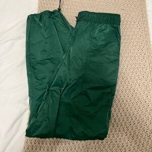 Green track pants